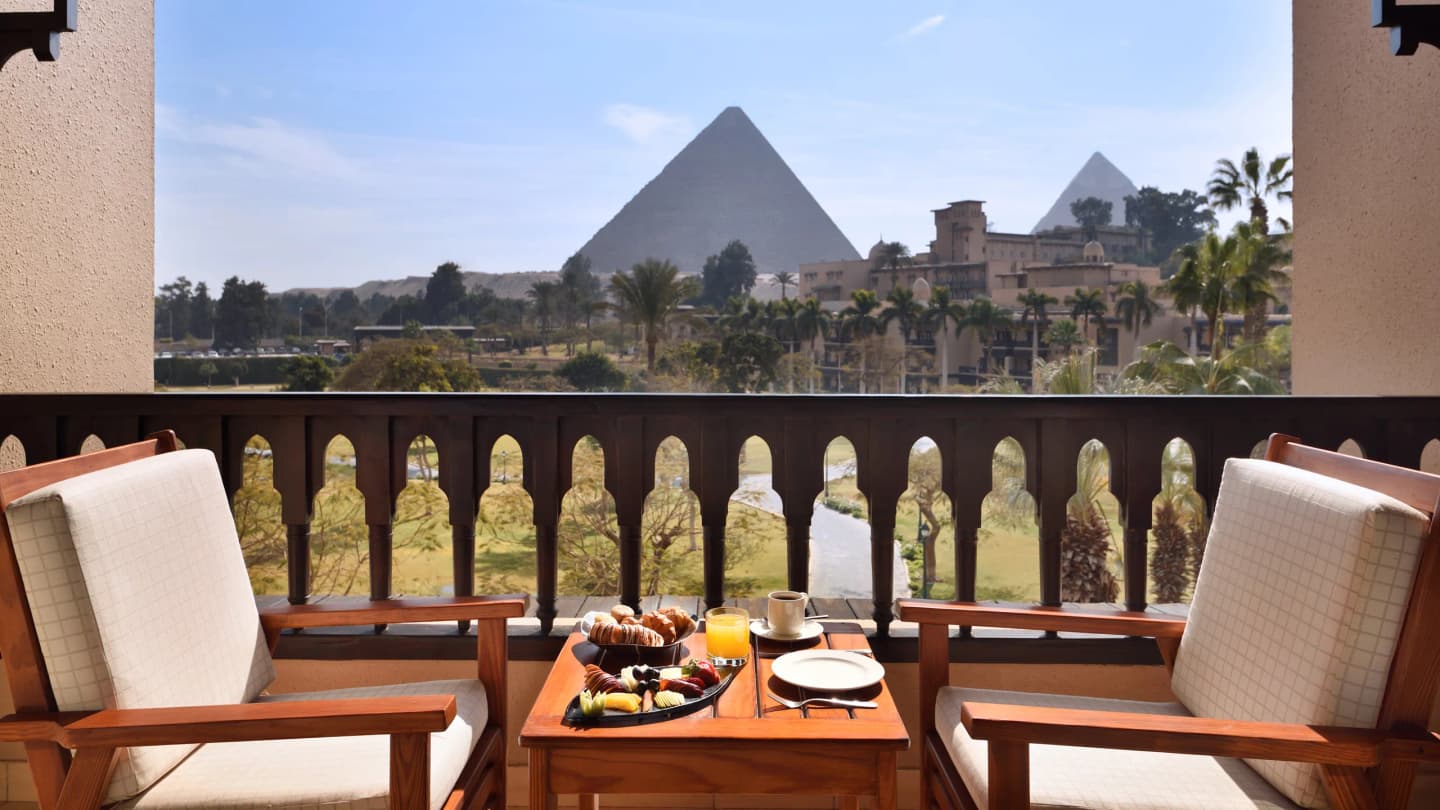 Breakfast on your private balcony overlooking the pyramids